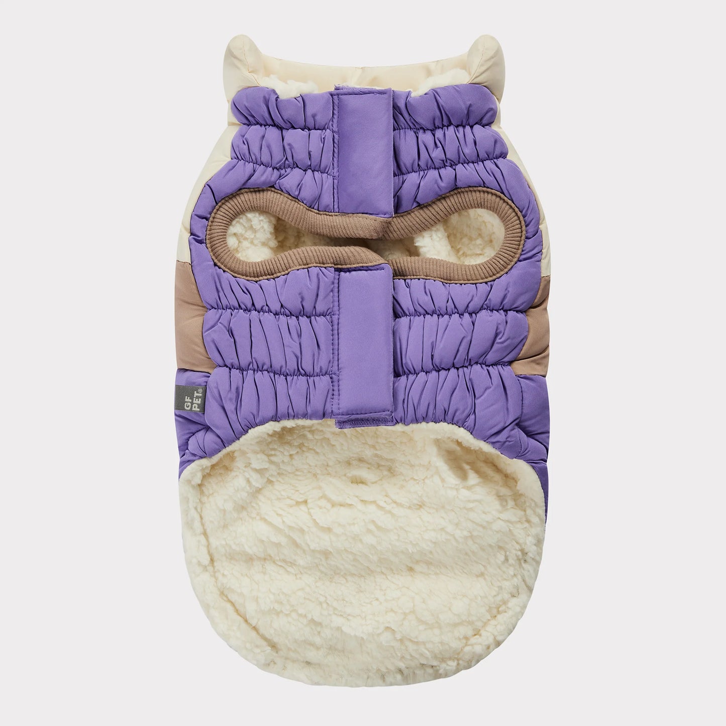 underside view of an ivory, beige and lavender color blocked puffer jacket for dogs
