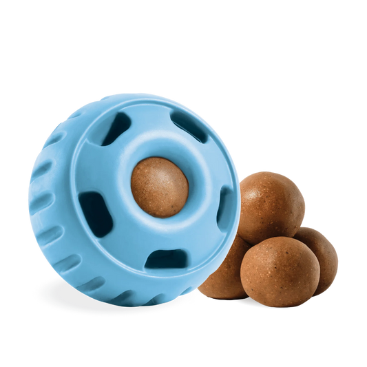 A round blue fillable treat toy with a brown treat inside and 4 brown treat balls beside it