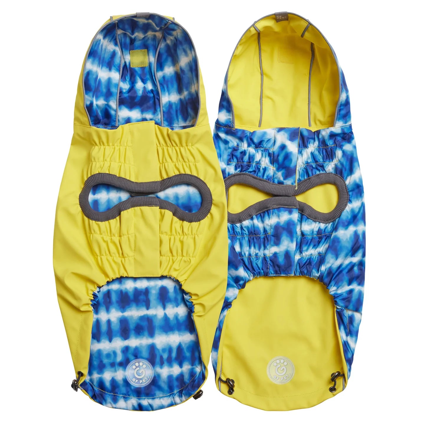 Underside view of a yellow reversible dog raincoat with a blue and white tie dye pattern on one side
