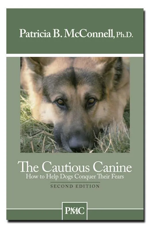 Book cover of 'The Cautious Canine' by Patricia B. McConnell with a German Shepherd on a grassy background.