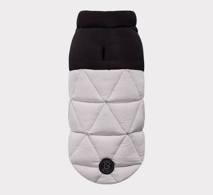 Quilted dog coat with black top and gray diamond pattern on a light gray background