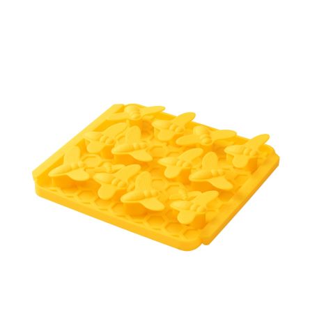 A dog work-to-eat lick mat with yellow raised bumblebee-shaped surface 