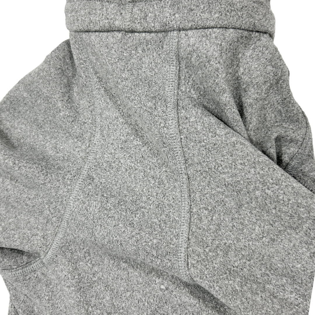 Closeup of the body fabric of a heathered grey onesie for dogs